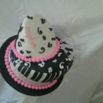 Funky 2-tier musical theme birthday cake in black and pink trim